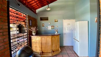 VENTA DE PROPIEDAD CON CABAÑAS, UNA CASA Y ESPACIOS RECREATIVOS.  en Santa Rosa, Santo Domingo, Heredia — $750,000 - Foto 5 de 14