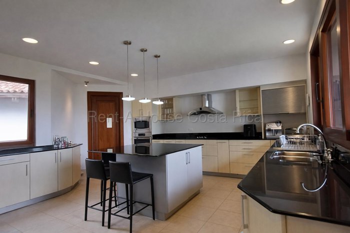 Venta de residencia de ultra lujo con vista panorámica al golf en Monterán #26-1500 GS en Granadilla, Curridabat, San José — $1,590,000 - Foto 2 de 12