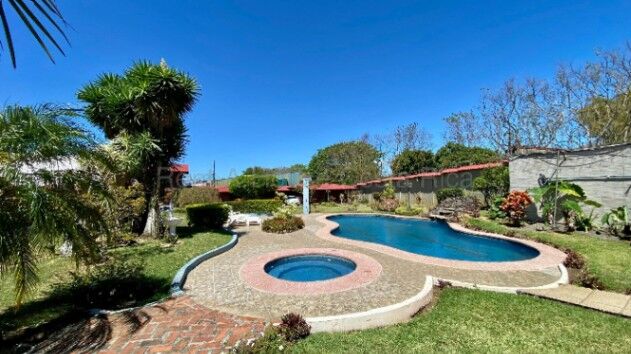 VENTA DE PROPIEDAD CON CABAÑAS, UNA CASA Y ESPACIOS RECREATIVOS.  en Santa Rosa, Santo Domingo, Heredia — $750,000