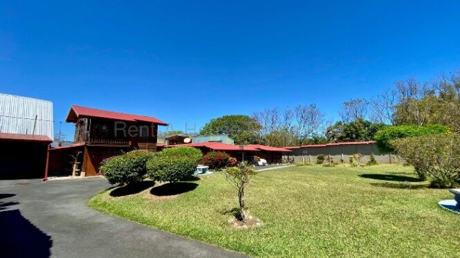 VENTA DE PROPIEDAD CON CABAÑAS, UNA CASA Y ESPACIOS RECREATIVOS.  en Santa Rosa, Santo Domingo, Heredia — $750,000
